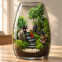 Handmade" means deliberate design. Every stone, plant, and miniature figurine is specifically chosen and positioned by an artist to create a cohesive, living scene.