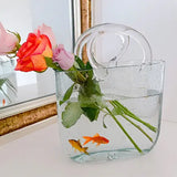 Handbag Fish Tank side angle showing full acrylic construction and internal water chamber