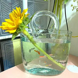 Handbag Fish Tank shown being carried, demonstrating its portable handbag-style design