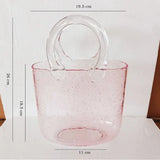 Handbag Fish Tank shown with betta fish inside as a creative desktop nano aquarium