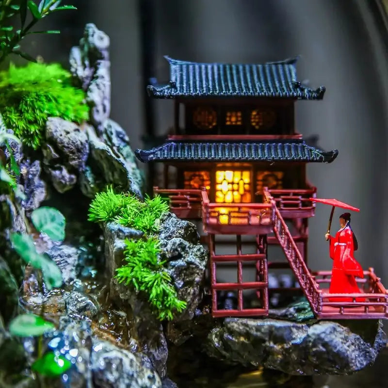 Close-up of Zen Pagoda Mini Paludarium showing detailed pagoda architecture surrounded by moss