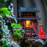 Close-up of Zen Pagoda Mini Paludarium showing detailed pagoda architecture surrounded by moss